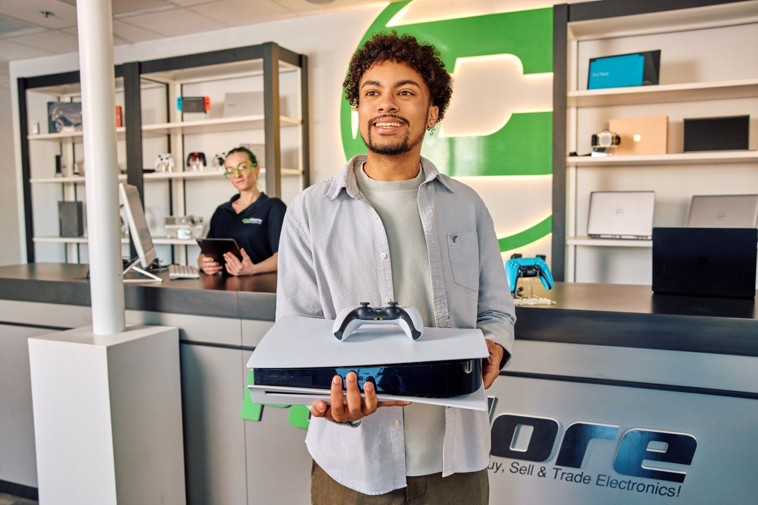 customer smiling after purchasing a gaming console